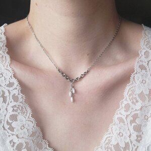 Antique white pearl necklace with a small silver chain